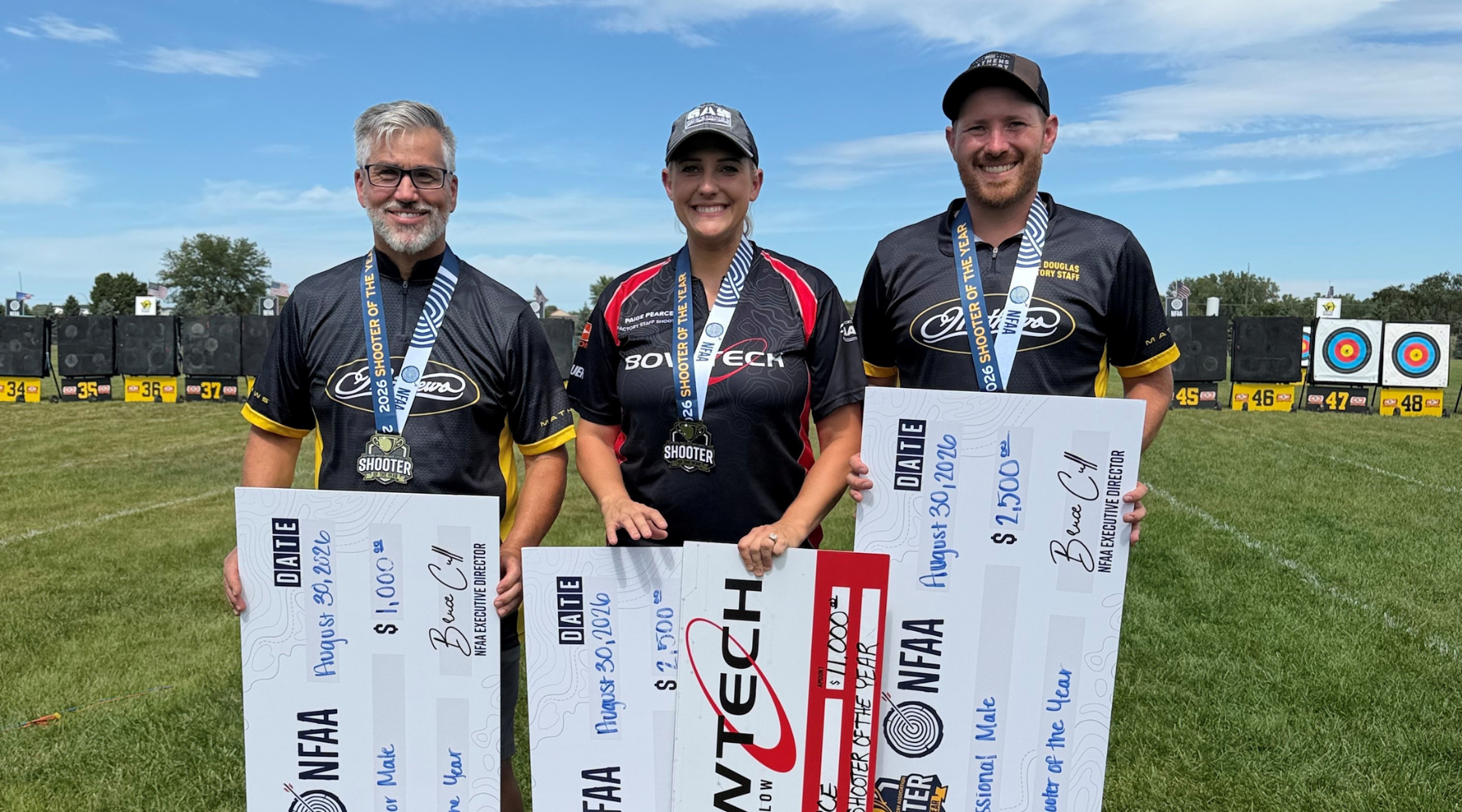 Kyle Douglas holding his Gold Tip arrows at the First Dakota Classic tournament
