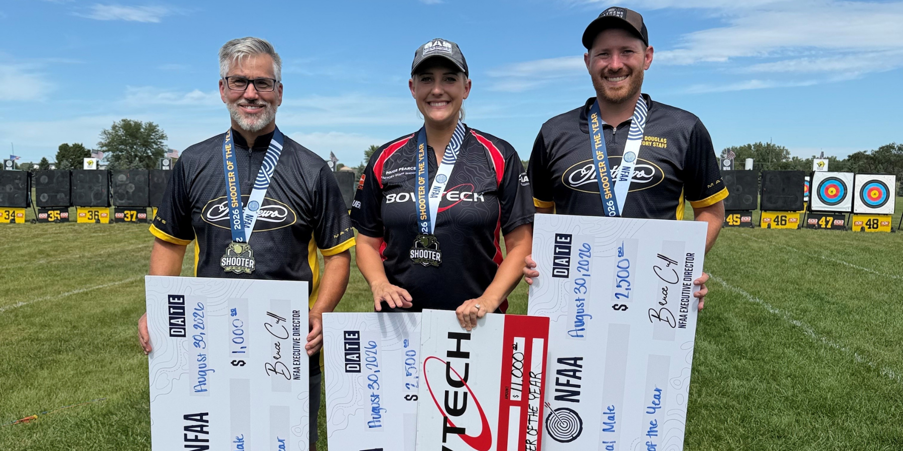 Kyle Douglas holding his Gold Tip arrows at the First Dakota Classic tournament