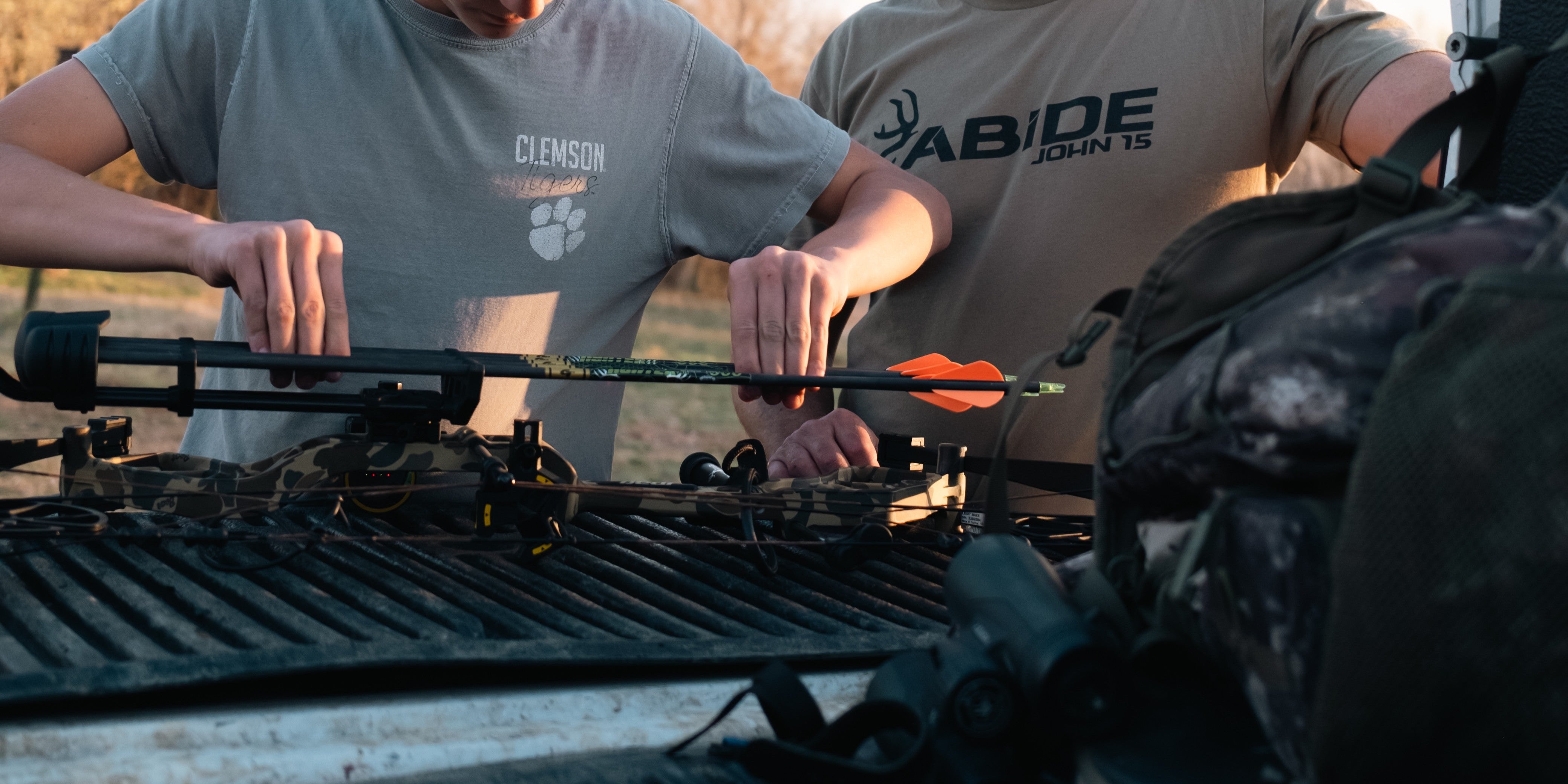 Archer performing bare shaft tuning with Gold Tip arrows