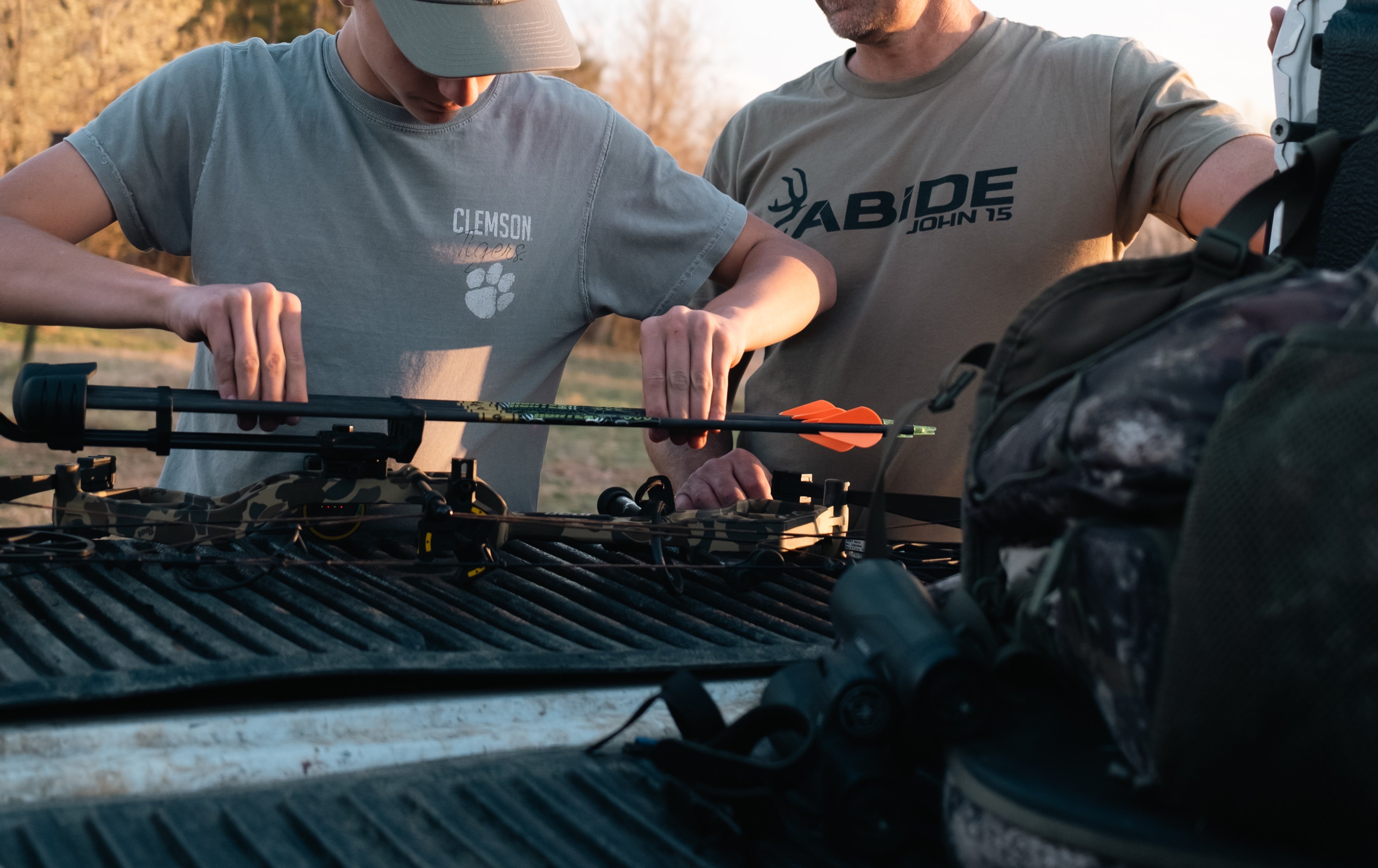 Archer performing bare shaft tuning with Gold Tip arrows