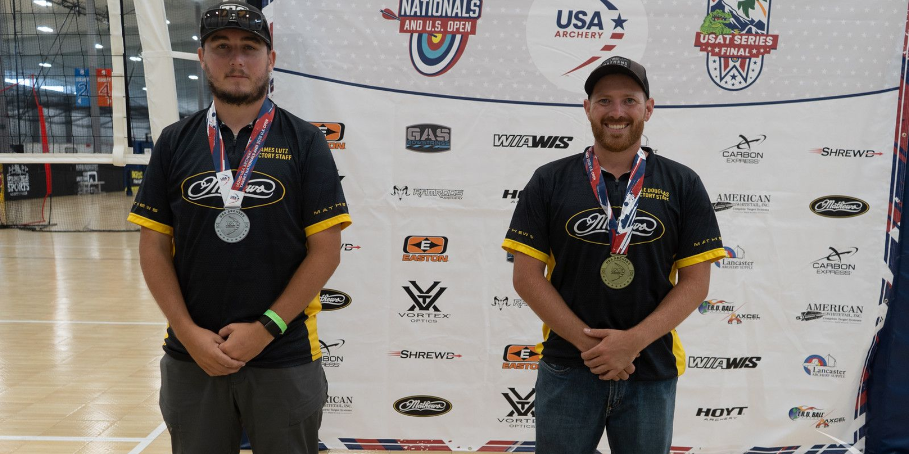 Kyle Douglas and Dewey Hathaway celebrating Gold Tip championship wins at the US Target Championship and US Open